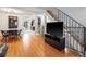 Open-concept living room with hardwood floors, staircase, and views to the exterior at 12993 W 20Th Ave, Golden, CO 80401