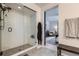 Stylish walk-in shower with subway tile and black hardware, creating a spa-like experience at 21038 E Quincy Pl, Aurora, CO 80015
