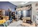 Teen bedroom featuring a loft bed design and a fun, colorful aesthetic, perfect for relaxing at 21038 E Quincy Pl, Aurora, CO 80015