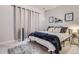 Comfortable bedroom with neutral tones, a plush rug, and stylish decor for a relaxing retreat at 21038 E Quincy Pl, Aurora, CO 80015