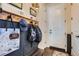 Functional entryway featuring a coat rack, bench, and stylish decor, perfect for organization at 21038 E Quincy Pl, Aurora, CO 80015