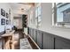 Inviting hallway with natural light, wooden floors, and stylish decor leading to various rooms at 21038 E Quincy Pl, Aurora, CO 80015