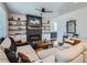 Inviting living room with cozy fireplace, built-in shelves, and comfortable sectional sofa at 21038 E Quincy Pl, Aurora, CO 80015