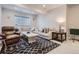 Inviting living room with a large sectional sofa, decorative rug, and ample space for entertaining at 21038 E Quincy Pl, Aurora, CO 80015