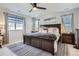 Bright main bedroom with a large window and a stylish rug, perfect for relaxation at 21038 E Quincy Pl, Aurora, CO 80015