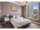 Inviting bedroom featuring plush bedding, city views, and stylish decor for a relaxing retreat at 2001 Lincoln St # 920, Denver, CO 80202