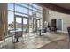 Spacious community room features floor to ceiling windows with views and multiple seating areas at 2001 Lincoln St # 920, Denver, CO 80202