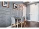 Contemporary dining area with a glass table, modern chairs, and stylish decor provides an inviting space at 2001 Lincoln St # 920, Denver, CO 80202