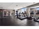 Building gym with treadmills, ellipticals, and weight training equipment, with large windows at 2001 Lincoln St # 920, Denver, CO 80202