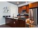 Modern kitchen featuring stainless steel appliances, island and stylish open shelving at 2001 Lincoln St # 920, Denver, CO 80202