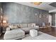 Comfortable living room features a plush sectional sofa, glass coffee table, and modern accent wall at 2001 Lincoln St # 920, Denver, CO 80202