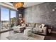Open living room with gray walls, dark wood floor, large window, and city view at 2001 Lincoln St # 920, Denver, CO 80202