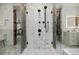 Modern bathroom with a walk-in shower, marble tiles, and luxurious fixtures at 1332 S Lafayette St, Denver, CO 80210