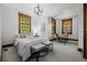 Bedroom with two distinct spaces, a bed area and study area with desk and chair at 1332 S Lafayette St, Denver, CO 80210