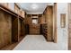 Spacious walk-in closet with custom wood shelving and drawers for optimal organization at 1332 S Lafayette St, Denver, CO 80210