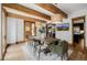 Dining room with wood beams, stylish light fixtures, and seating for six at 1332 S Lafayette St, Denver, CO 80210