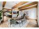 Dining room with wood beams, stylish light fixtures, and seating for six at 1332 S Lafayette St, Denver, CO 80210