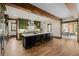 Spacious kitchen with center island, pendant lighting, and green cabinetry at 1332 S Lafayette St, Denver, CO 80210
