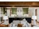 Green kitchen with large island, stainless steel appliances, and ample counter space at 1332 S Lafayette St, Denver, CO 80210