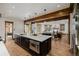 Spacious kitchen island with a built-in microwave and an open view to the living room at 1332 S Lafayette St, Denver, CO 80210