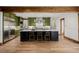 Open kitchen featuring a large island, stainless steel appliances, and green cabinetry at 1332 S Lafayette St, Denver, CO 80210
