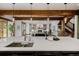 Bright kitchen featuring a large island, wooden beams, and an open floor plan into the living room at 1332 S Lafayette St, Denver, CO 80210