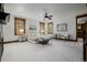 Spacious primary bedroom featuring neutral colors, beamed ceilings, and natural light at 1332 S Lafayette St, Denver, CO 80210