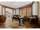 Office with hardwood flooring, wood-trimmed windows, and a view of a fireplace at 1332 S Lafayette St, Denver, CO 80210