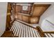 Ornate wood staircase and ceiling design with statement lighting, creating a sophisticated and classic entryway at 1332 S Lafayette St, Denver, CO 80210