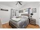 Cozy bedroom with wood-look flooring and a ceiling fan at 3736 S Lincoln St, Englewood, CO 80113