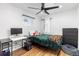 Small bedroom with a desk, dresser, and ceiling fan at 3736 S Lincoln St, Englewood, CO 80113