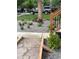 Landscaped front yard with stone pathway and colorful flowers at 3736 S Lincoln St, Englewood, CO 80113