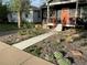 Newly landscaped front yard with walkway at 3736 S Lincoln St, Englewood, CO 80113