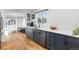 Bright kitchen with white countertops and dark blue cabinetry at 3736 S Lincoln St, Englewood, CO 80113