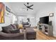 Spacious living room featuring hardwood floors, ceiling fan at 3736 S Lincoln St, Englewood, CO 80113