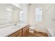 Clean bathroom with single vanity and tub shower combo at 1546 Farmstead St, Brighton, CO 80601