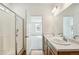 Modern bathroom with double vanity and walk-in shower at 1546 Farmstead St, Brighton, CO 80601