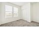 Simple bedroom with carpet flooring and neutral walls at 1546 Farmstead St, Brighton, CO 80601