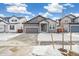 Two-story house with gray siding and a front yard at 1546 Farmstead St, Brighton, CO 80601