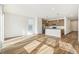 Living room with hardwood floors and kitchen island at 1546 Farmstead St, Brighton, CO 80601