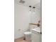 Modern half-bathroom with a sleek vanity, hardwood floors, pendant lighting, and stylish fixtures at 1750 Wewatta St # 809, Denver, CO 80202