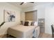 Bedroom featuring a sofa bed converted to a cozy bed with stylish pillows, creating a welcoming atmosphere at 1750 Wewatta St # 809, Denver, CO 80202