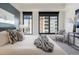 Comfortable bedroom featuring large windows with city views, ample natural light, and tasteful decor at 1750 Wewatta St # 809, Denver, CO 80202