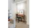 Stylish home office space featuring a wooden desk, chair, and tastefully decorated walls and shelves at 1750 Wewatta St # 809, Denver, CO 80202
