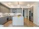 Stylish kitchen boasts gray cabinets, white countertops, and a stainless steel refrigerator and oven at 1750 Wewatta St # 809, Denver, CO 80202