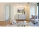 Cozy living room showcasing modern decor and a stylish cabinet with gold accents at 1750 Wewatta St # 809, Denver, CO 80202
