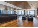 Bright resident lounge with hardwood floors, modern lighting, city views, and comfortable seating at 1750 Wewatta St # 809, Denver, CO 80202