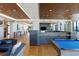 Spacious resident lounge featuring hardwood floors, billiards table, modern lighting, and contemporary decor at 1750 Wewatta St # 809, Denver, CO 80202