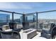 Cozy rooftop patio featuring comfortable seating, a fire pit, and panoramic city views at 1750 Wewatta St # 809, Denver, CO 80202