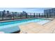 Stunning rooftop pool with panoramic city views and comfortable lounge furniture at 1750 Wewatta St # 809, Denver, CO 80202
